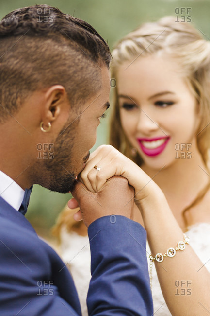 Wedding, newlyweds, happy, diversity, love, hand kiss, bridal jewelry