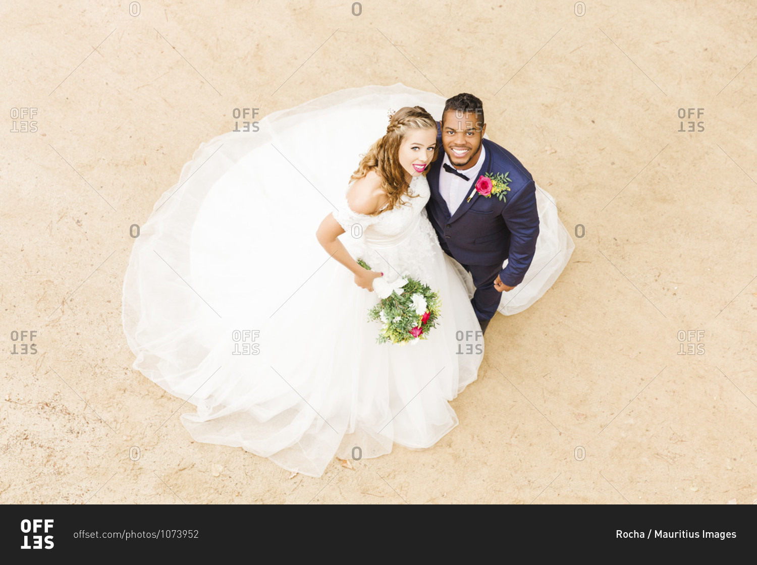 Wedding, newlyweds, young adults, diversity, love, sand, bird\'s eye view