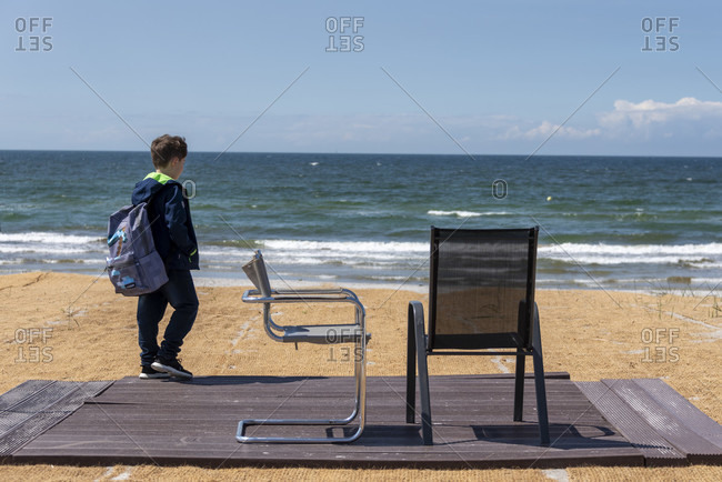 Boy, two chairs, vitte beach, hiddensee