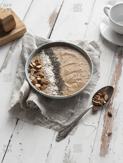 Smoothie bowl with almonds, chia seeds and coconut