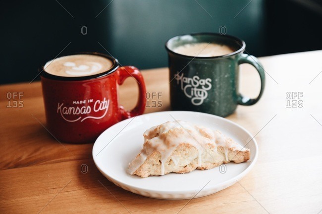 Scone on table with lattes in a cafe in Kansas City, Missouri