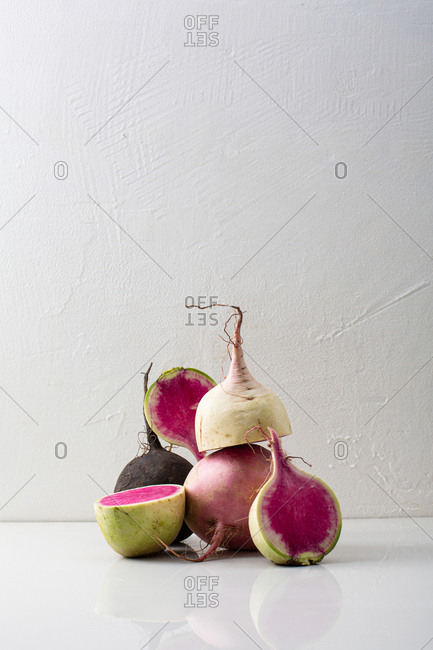 Still life with whole and sliced melon radishes
