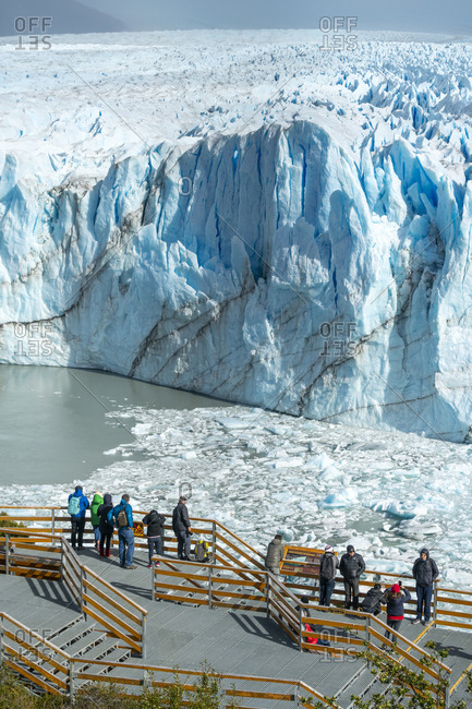 April 4, 2019: Group of tourists admiring Perito Moreno Glacier, Argentina, Santa Cruz