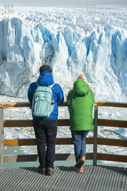 April 4, 2019: Two people admiring Perito Moreno Glacier, Argentina, Santa Cruz