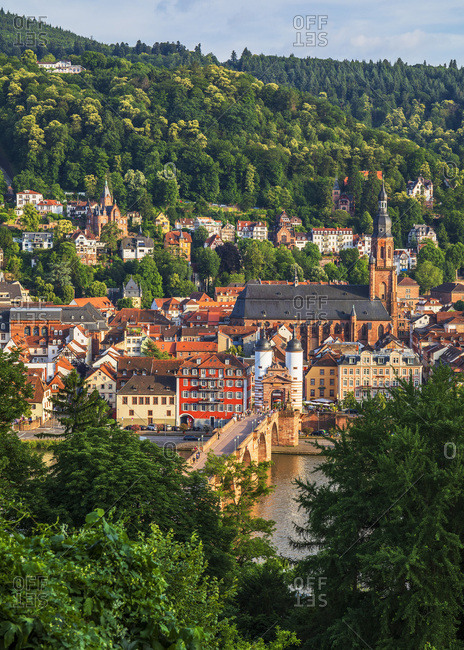 June 23, 2019: Old Town (Altstadt) along the Neckar River, with the Karl Theodor Bridge, Church of the Holy Spirit and the Castle on the hill