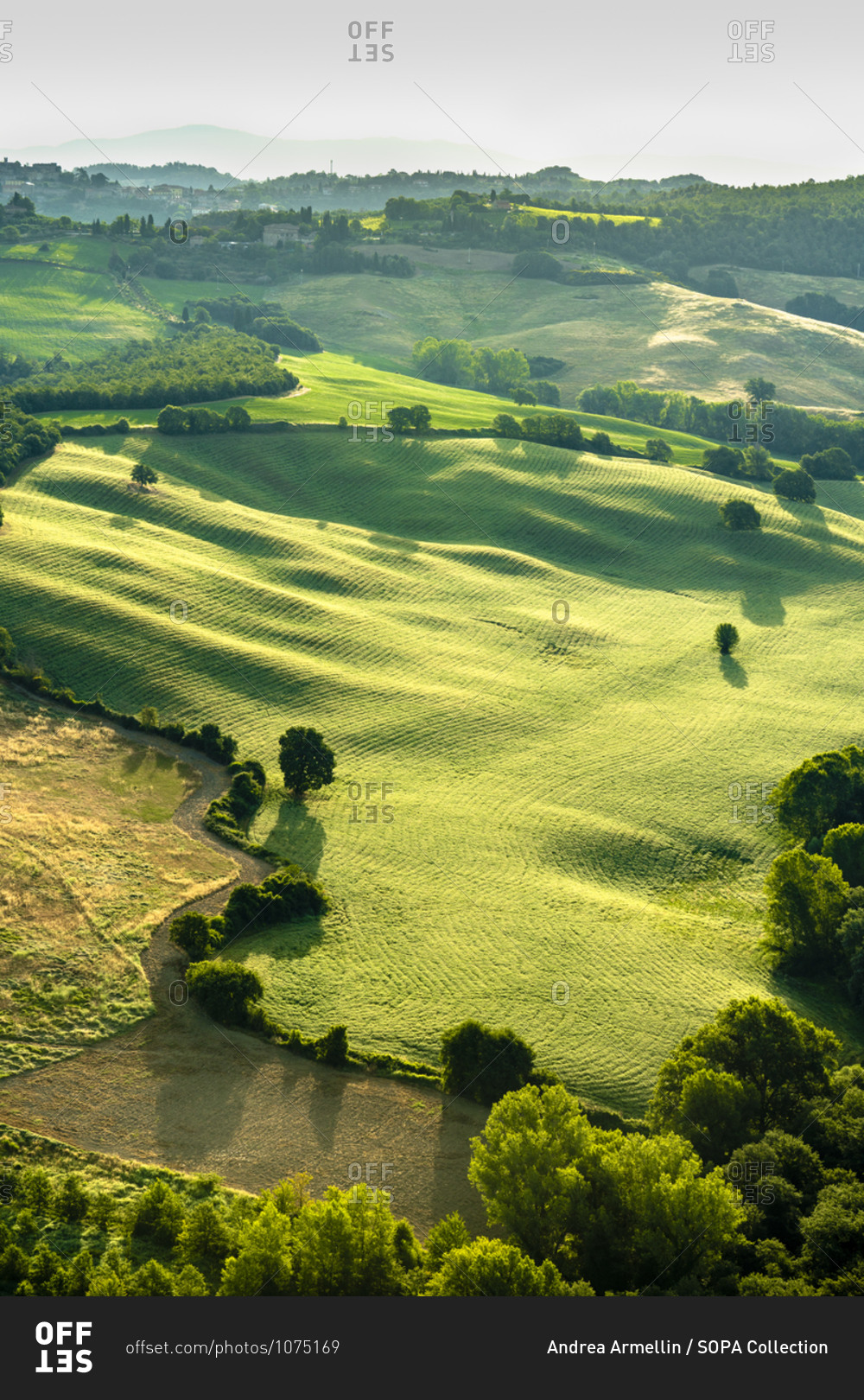 July 2, 2018: The countryside of the Val d\'Orcia seen from a\
hot air balloon, Tuscany, Italy stock photo - OFFSET