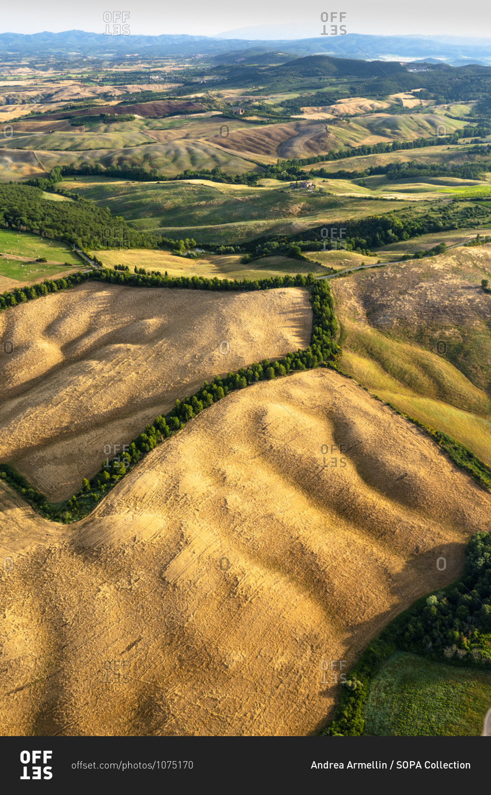 July 2, 2018: The countryside of the Val d\'Orcia seen from a\
hot air balloon, Tuscany, Italy stock photo - OFFSET