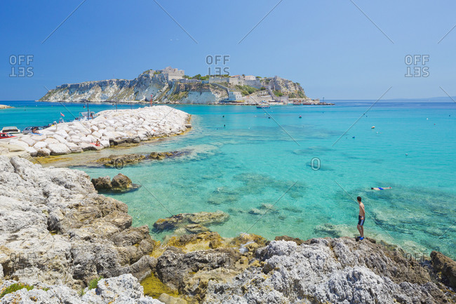July 2, 2013: Beach of San Domino island towards Cretaccio and Capraia island (Caprara)