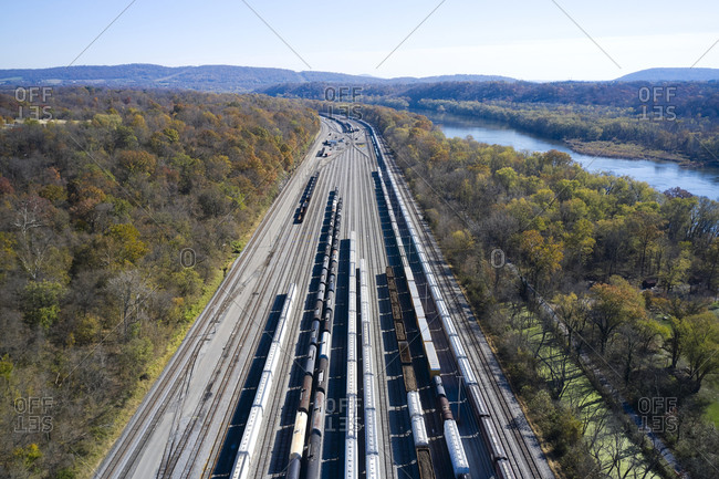 Aerial view of railroad cars waiting on tracks stretching along Chesapeake and Ohio Canal