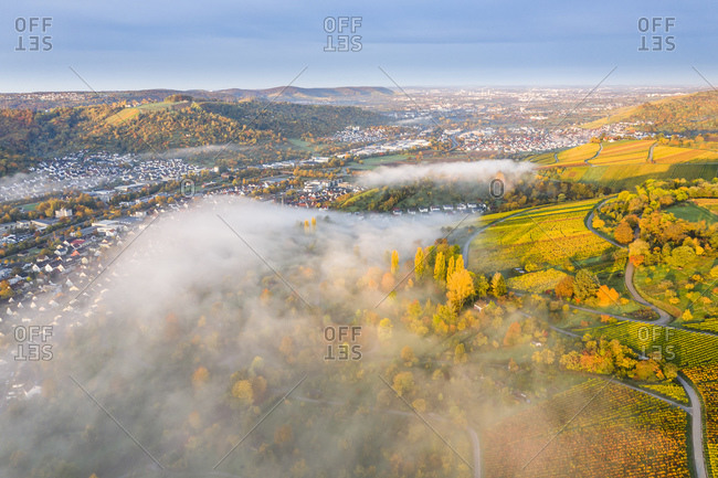 Germany- Baden Wurttemberg- Remstal- Drone view of countryside town at foggy dawn