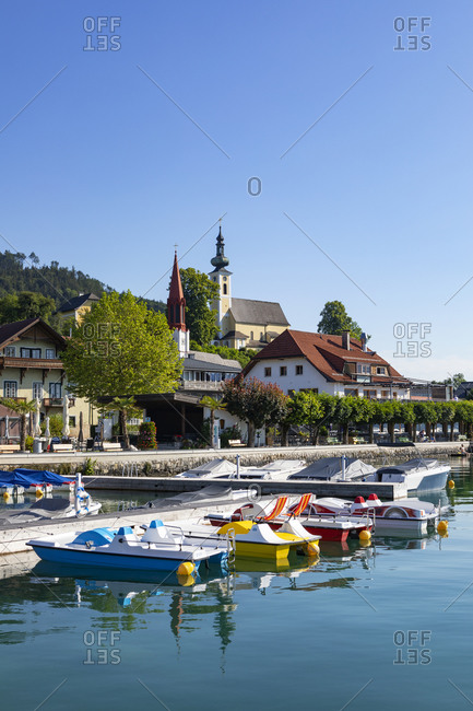 Austria- Upper Austria- Attersee am Attersee- Pedal boats moored in marina of lakeshore village in summer