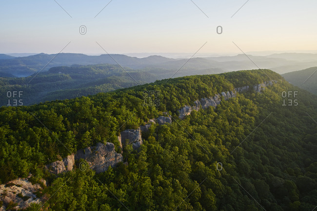 Aerial view of forested cliff in Appalachia at dawn