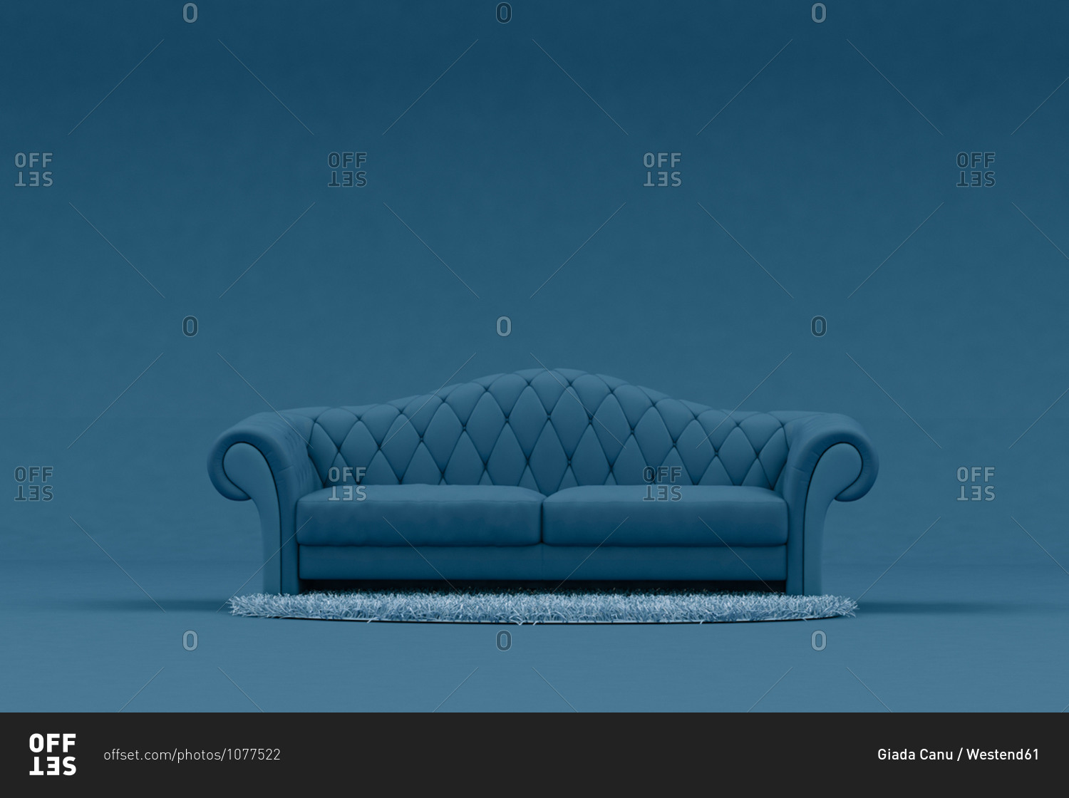 Blue sofa with light blue rug