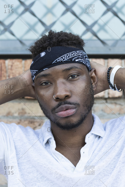 Confident young man wearing headscarf
