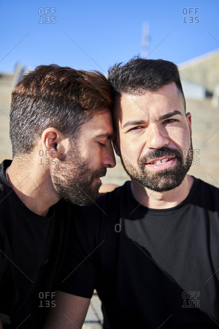 Romantic homosexual couple spending leisure time together during sunny day