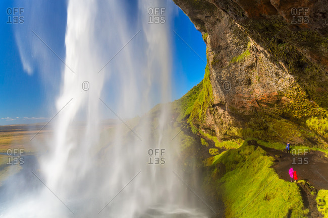 The spectacular Seljalandsfoss Waterfall, water tumbling from overhead