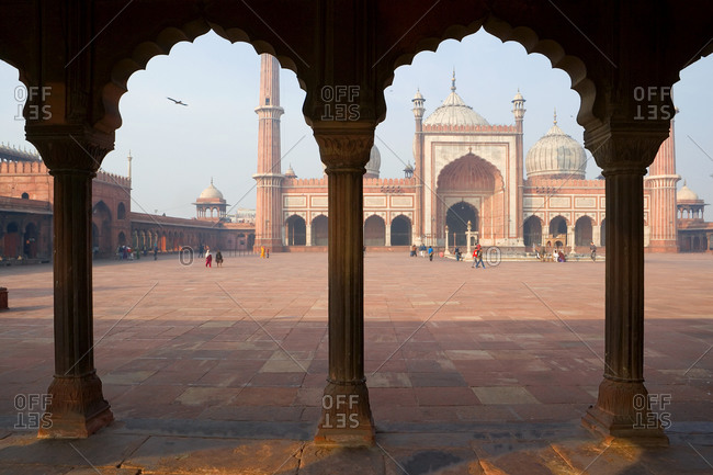 January 8, 2021: Jama Masjid Mosque Delhi, the courtyard at a mosque, with a colonnade with scalloped edged arches, Delhi, India
