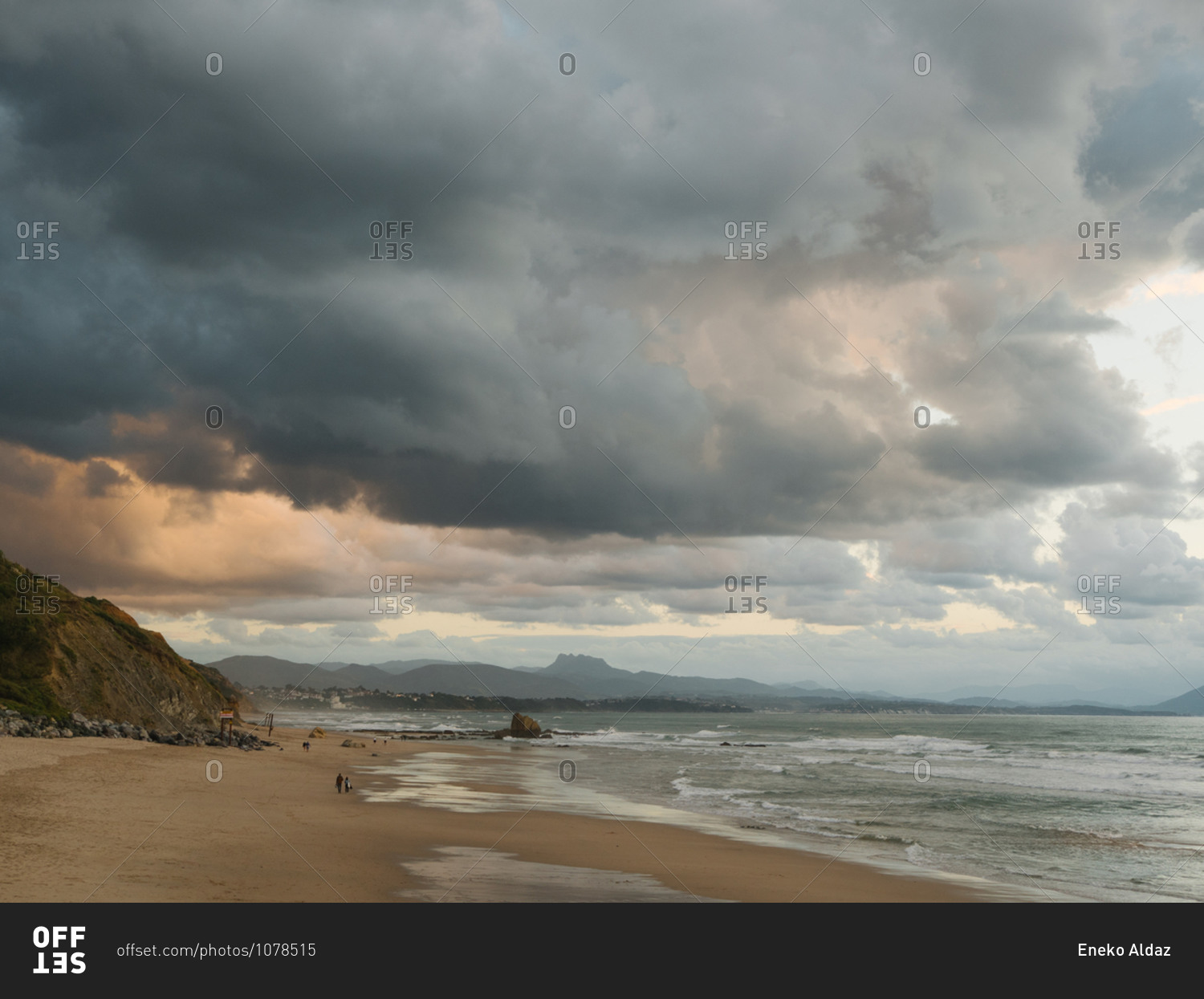 Almost empty beach in Biarritz with dark and epic sky in background