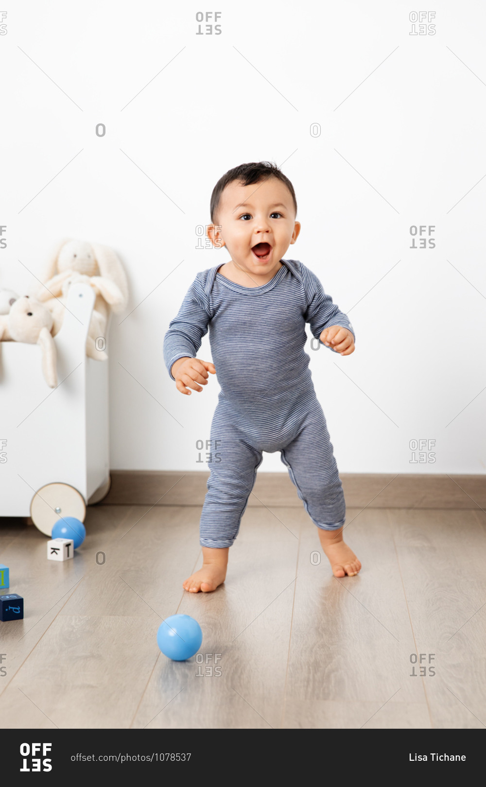 Cute toddlers making first steps with proud funny face