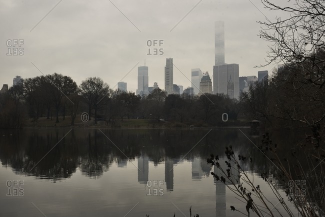 Calm lake in Central Park on cloudy day in fall in New York