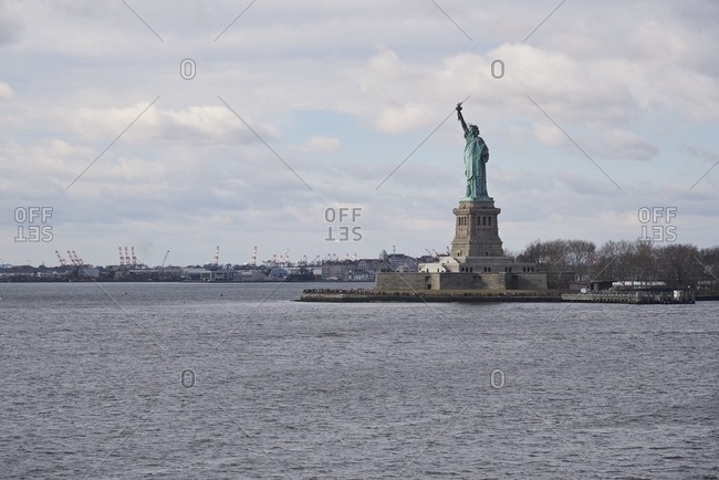 Distant view of famous national monument of Statue of Liberty in New York city