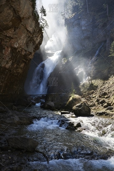 Scenic view of waterfall in highland area in Pyrenees mountains on sunny day in Ordesa Valley