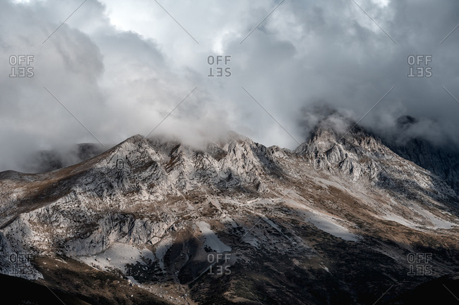 Mist landscape of mountains in autumn with cloudy sky