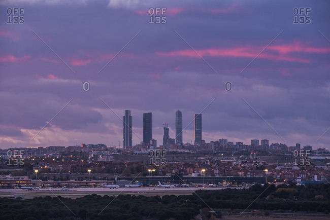 Amazing view of Cuatro Torres business area with skyscrapers under sundown sky in Madrid