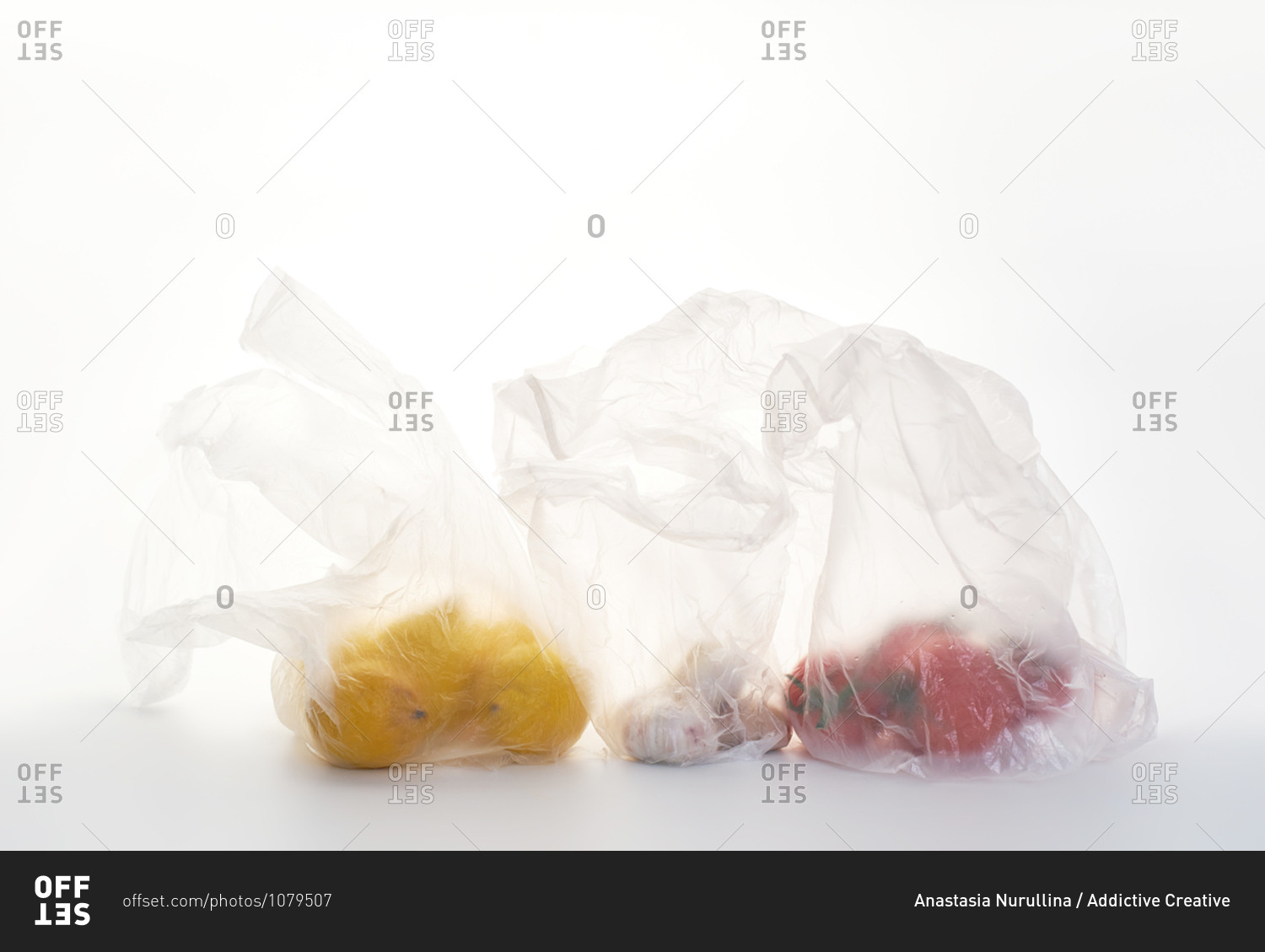 Still life with food in plastic bags backlit on white background