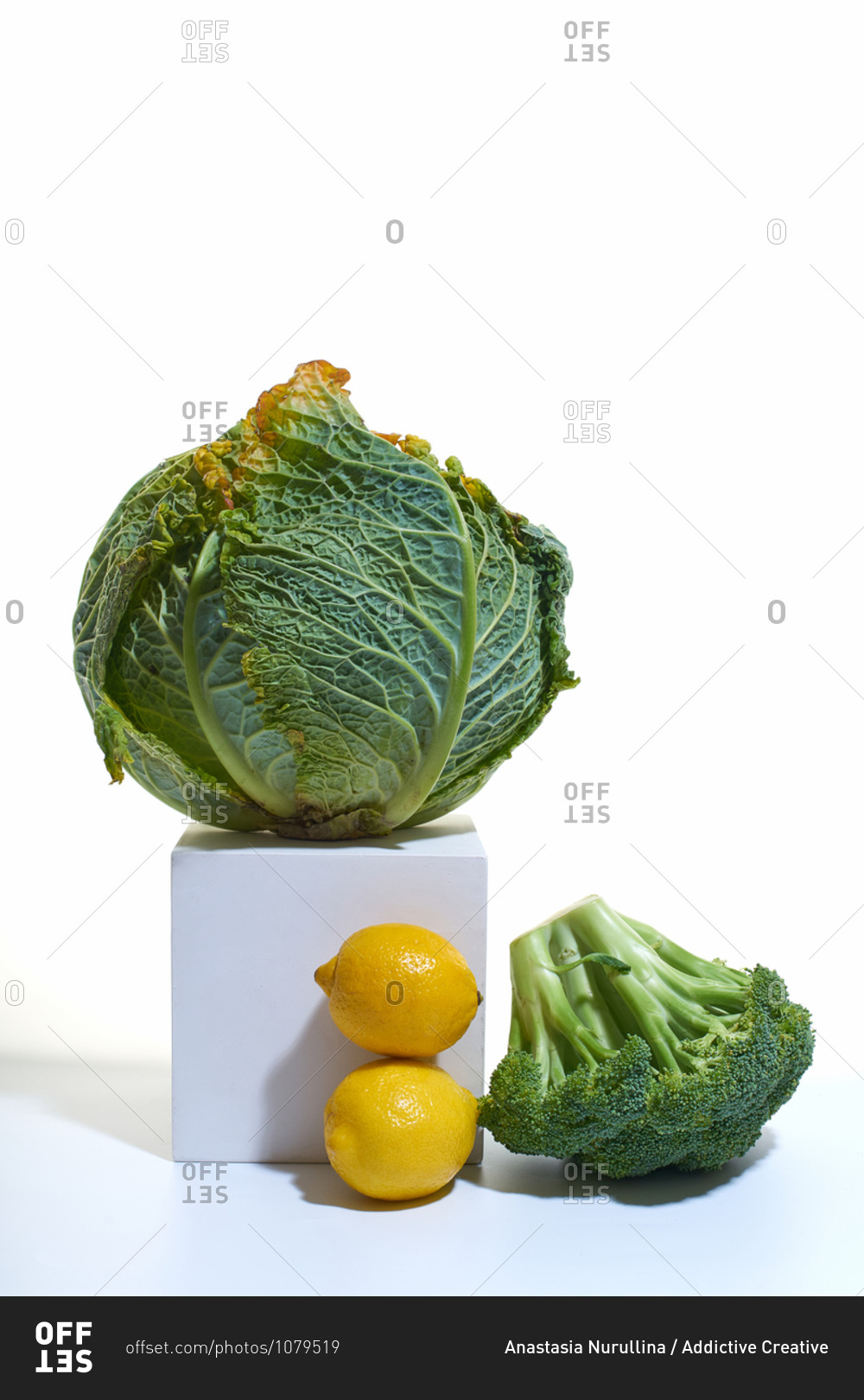 Still life with savoy cabbage, broccoli and lemons