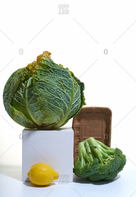 Still life with savoy cabbage, broccoli and lemons