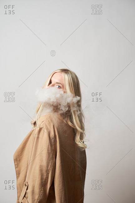 Premium Photo  Vape man exhales a cloud of steam neon light