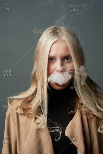 Premium Photo  Vape man exhales a cloud of steam neon light