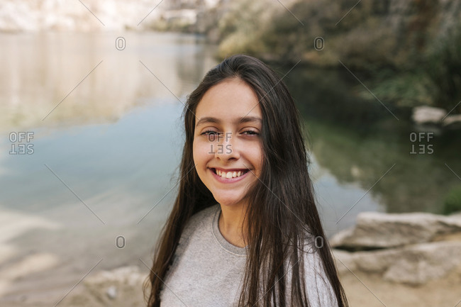 Portrait of young teenage girl in a nature environment