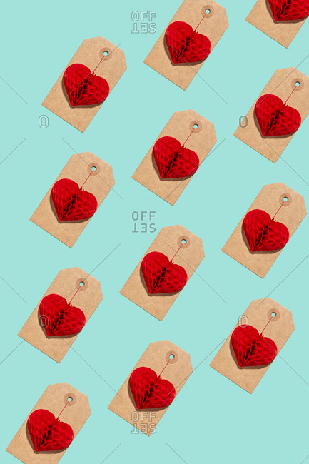 Pattern of labels with heart shaped paper craft decorations