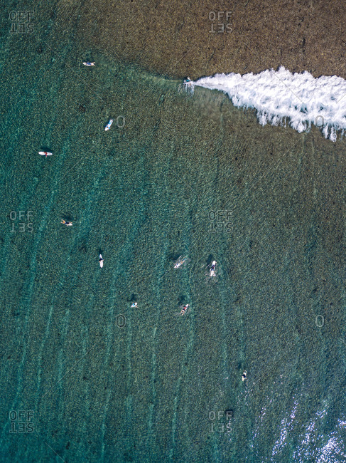 Surfers on sea waves- aerial view