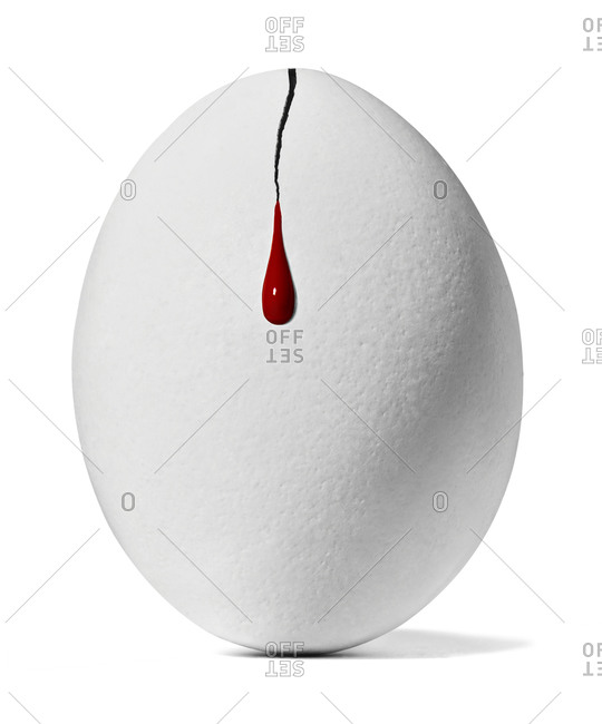 Blood spilling from cracked chicken egg