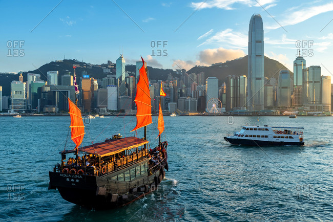 May 19, 2018: An old vessel sailing with Hong Kong skyline behind
