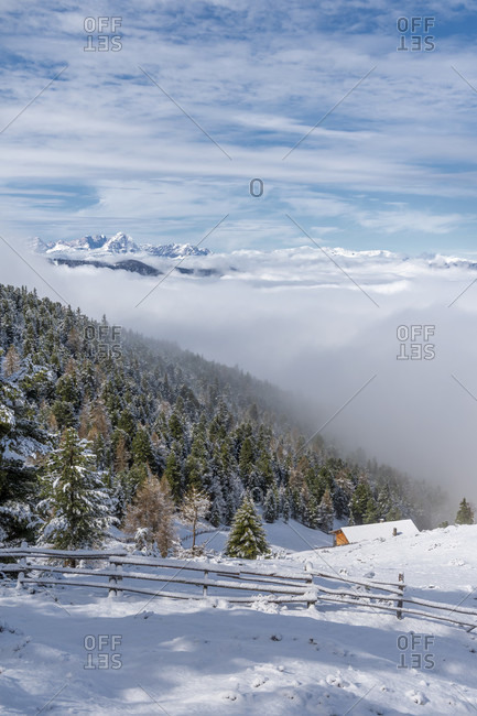 Percha, Bolzano province, South Tyrol, Italy. Snow in spring above the Gonner Alm. In the background the Dolomites