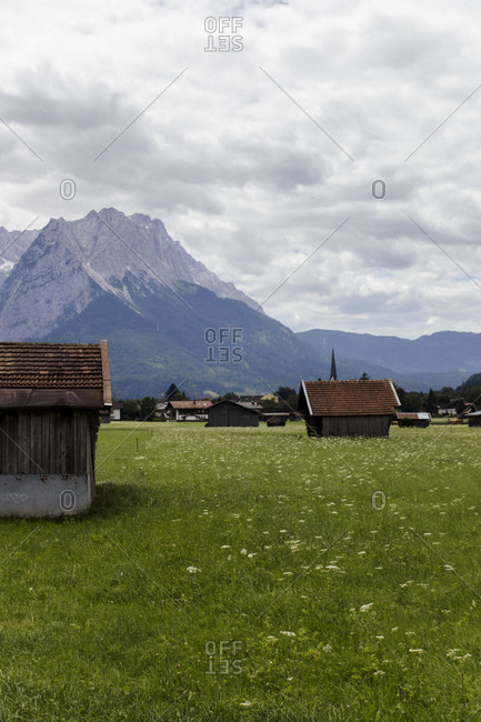 Wooden hut - hay barn in Garmisch-Partenkirchen with alpine panorama in the background