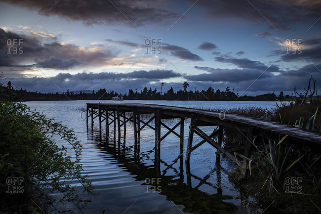 Evening mood and boardwalk on Lake Brunner, South Island New Zealand