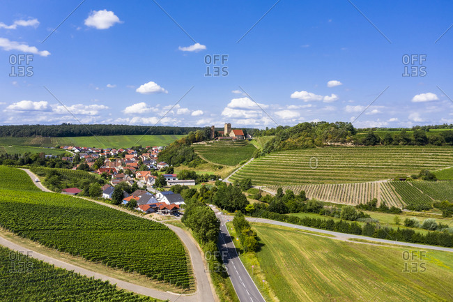 Germany- Baden-Wurttemberg- Brackenheim- Aerial view of vineyards in front of countryside town in summer