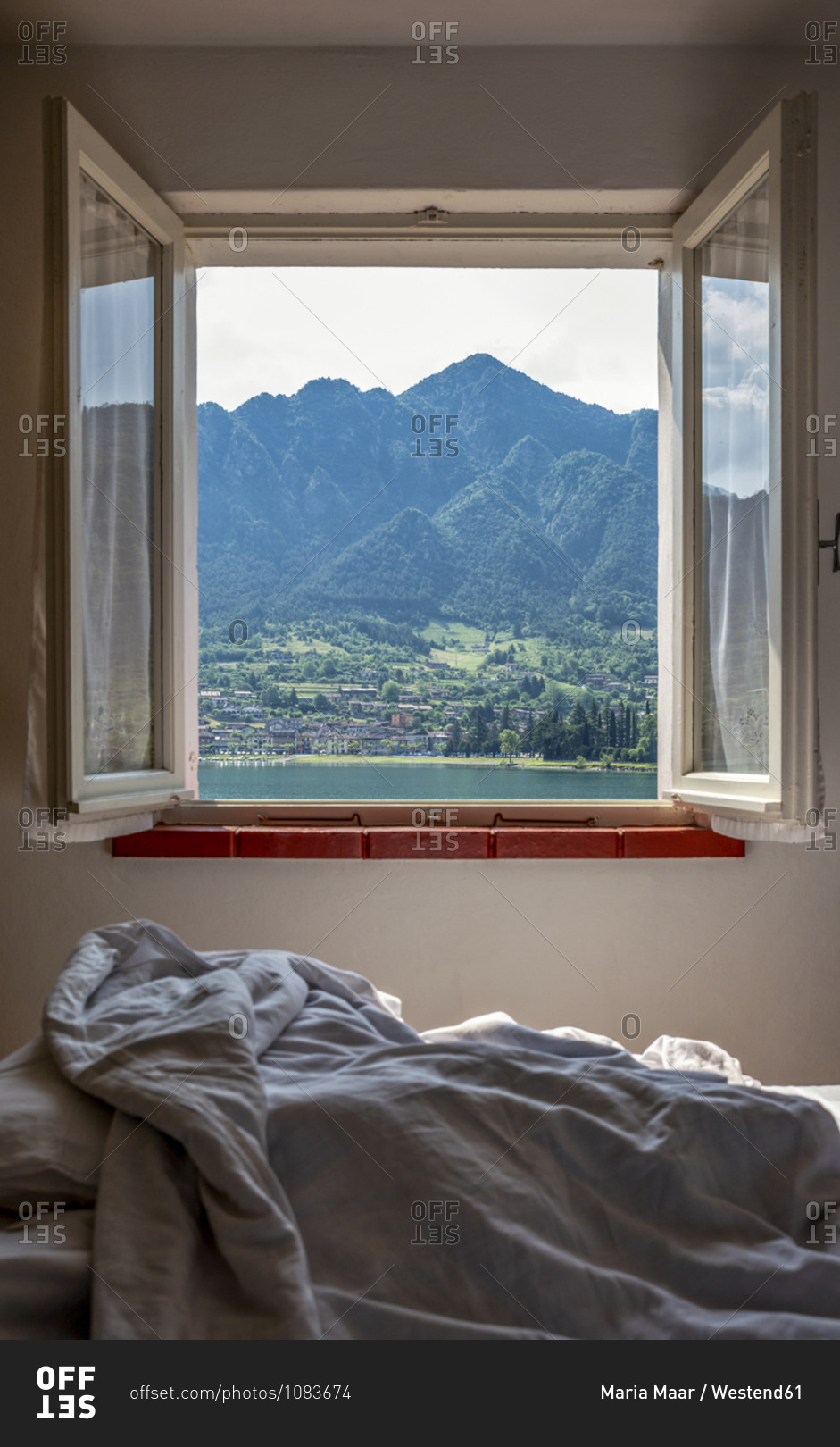 Mountain range seen through bedroom window