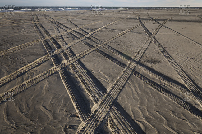 Four wheel drive paths criss cross in the sand on Ocracoke Island, North Carolina