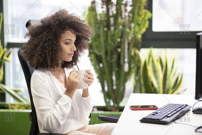 Premium Photo  Pensive woman sitting at table while thinking