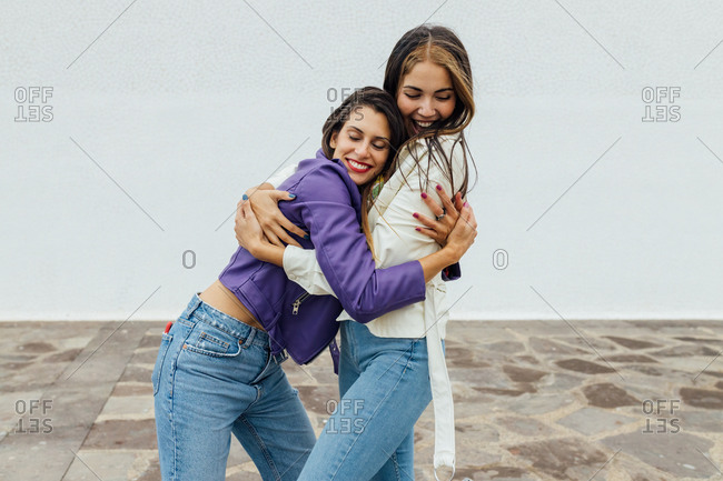 Fashion portrait of two friends posing. modern lifestyle. two stylish sexy  hipster girls best friends ready for party. Two young girl friends standing  together and having fun. Stock Photo | Adobe Stock