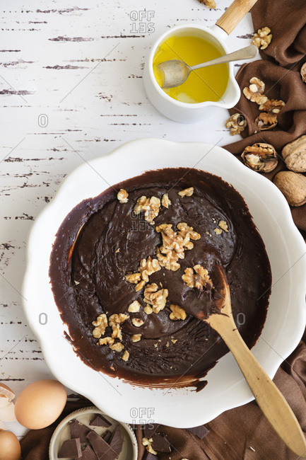 Walnuts stirred into chocolate brownie batter.
