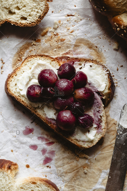 Sliced challah with grapes and butter