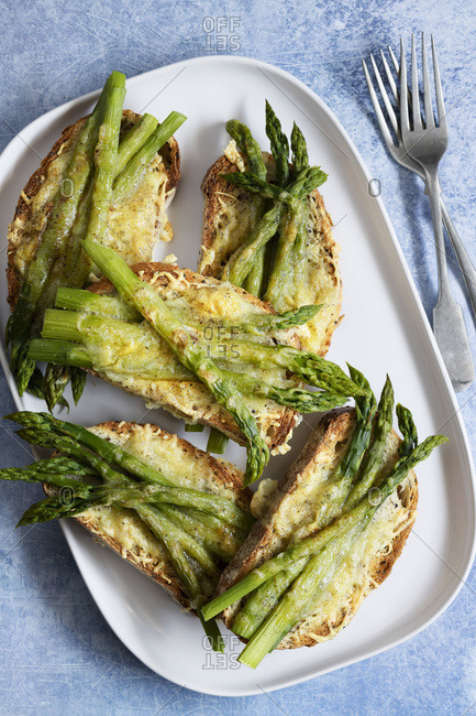 Grilled asparagus and cheese on sourdough bread.