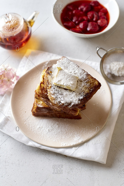 French toasts for breakfast with butter and powdered sugar